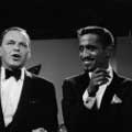 Taken during the filming of Sammy Davis Jr television show in 1966 by Milton H Greene. Frank Sinatra is the guest and is to the right of Sammy talking as Sammy smiles.